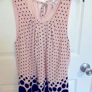 Sleeveless top, pink with black polka-dots.  Large